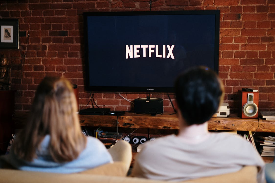 Couple watching a streaming service on their television — the kind of personalized experience most companies still can't deliver